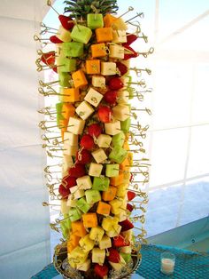 a fruit tower is displayed on a table