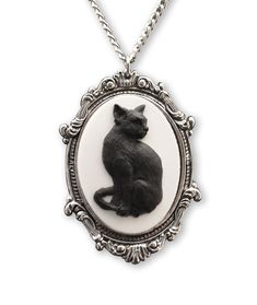 PRICES MAY VARY. Beautifully crafted black cat cameo, black on white Frame made out of high grade pewter with an anti-tarnish silver finish Two color resin cameo in a silver antique finish frame Pendant size is 2 1/4 inches long x 1 1/2 inches wide on a 20 inch neck chain Hand crafted and MADE IN USA This beautifully fashioned twenty inch necklace and pendant is a unique piece. The pendant is cast in fine pewter and plated with an anti-tarnish silver finish. All of our necklaces are hand crafted Black Cat Jewelry, Black Cat Necklace, Gothic Pendant, Cameo Pendant Necklace, Pewter Jewelry, Cameo Jewelry, Antique Pendant, Steampunk Jewelry, Cameo Necklace