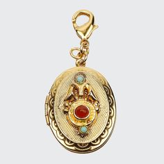 Locket charm by Ben-Amun. 24-karat yellow gold plating. Locket with multicolor glass stones. Charm only; chain not included. Approx. 1.75"L x 1"W. Lobster clap. Made in USA. Circle Of Spores Druid, Spores Druid, Gold Lockets, Unique Locket, Talisman Pendant, Brand Mood Board, Oval Locket, Vintage Lockets, Floating Charms