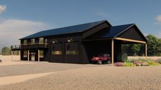 a black garage with a red truck parked in front of it