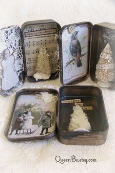 there are four small tins with pictures in them