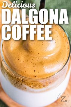 a close up of a drink in a glass on a plate with the words delicious dalgona coffee