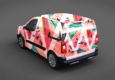 a colorful car with abstract designs on the back and side doors, is shown in this image