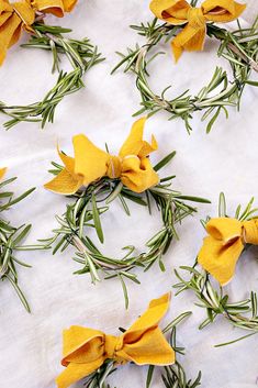 yellow flowers are arranged on a white cloth