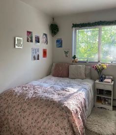 a bed sitting under a window in a bedroom