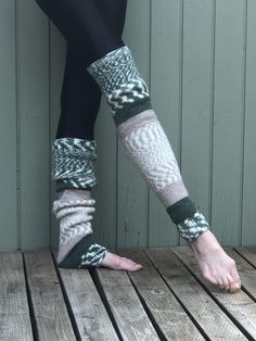 These hand knit over the knee/thigh high leg warmers will soon be your favorite.  Wear them over tights, with your shorts or under track pants.  They are long enough to pull over the knee, or slouched down over cold feet.  Perfect accessory for the cold fall and winter months.    Wear them to your yoga, Pilates or ballet class.   Hand knit from a warm and cozy yarn of 80% acrylic and 20% wool in solid and fair isle stripes of  forest green, tan,  and cream. Color placement varies n each pair.  The pair received may be slightly different than pictured.  Measures approximately  25" in length, 12" at the knee and 8" at ankle.  Measurements taken flat before stretching.  Model is 5' 9" and wears a size 2/4.  Best fits a small/medium.   Machine wash warm, tumble dry low or hand wash and dry fla Leg Warmers Ballet, Ballet Leg Warmers, Long Leg Warmers, Thigh High Leg Warmers, Ballet Class, High Leg, Winter Months, Socks And Hosiery, Long Legs