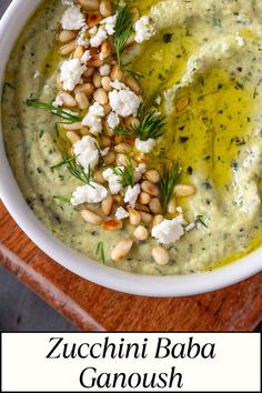 a white bowl filled with garbanzo and topped with feta cheese on top