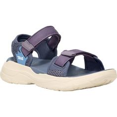 We love how comfy Teva's Zymic Sandal feels on our feet--while also leaving a smaller footprint on the environment. A mix of recycled plastic, EVA, and polyester come together to create a cloud-like sandal perfect for our casual warm weather outings. Summer Outdoor Sport Sandals Non-slip, Teva Zymic, Functional Non-slip Sandals For Hiking, Slip-on Hiking Sandals, Slip-on Sport Sandals With Rubber Sole For Hiking, Non-slip Synthetic Sport Sandals For Hiking, The Environment, Come Together, Recycled Plastic