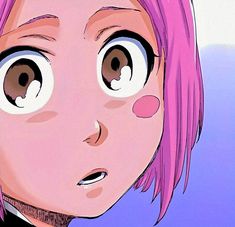 a close up of a person with pink hair and big eyes looking at the camera