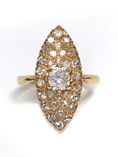 If you are looking for an antique diamond ring that is truly unique, then this is the perfect piece for you. The 18K antique diamond ring features an Old European Cut center diamond, which is extremely rare and highly sought after by collectors. This ring is made of the highest quality materials and will last a lifetime. The center diamond is surrounded by smaller diamonds to create a stunning effect. This ring is a statement piece that will surely turn heads. 18K antique diamond ring Old Europe Antique Brilliant Cut Diamond White Diamond Ring, Antique Brilliant Cut Diamond White Ring, Antique Diamond White Diamond Ring With Brilliant Cut, Oval Yellow Gold Diamond Ring With Rose Cut, Antique Diamond White Diamond Ring, Antique Diamond Ring With Rose Cut For Anniversary, Antique Diamond Ring With Rose Cut Diamonds For Anniversary, Victorian Diamond Ring With Round Cut, Antique Rose Cut Diamond Ring For Anniversary