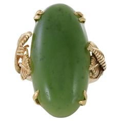 This estate Retro era ring features a striking genuine oval jade stone set in warm 18KT yellow gold. The jade stone has a rich, deep green color with a beautiful translucency that catches the light in a unique and captivating way. The ring's gold setting is simple yet elegant, with a classic Retro era design that is both timeless and modern. The ring's bold design and striking color make it a perfect statement piece, ideal for those who appreciate the natural beauty of gemstones and the allure o Deep Green Color, Retro Era, Jade Ring, Jade Stone, Bold Design, Belleza Natural, Deep Green, Stone Settings, Style Retro