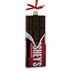 a chocolate bar ornament hanging from a red ribbon