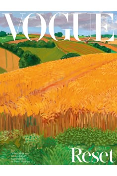 the front cover of a magazine with an image of a wheat field and trees in the background