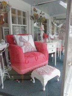 a red chair and ottoman in a room