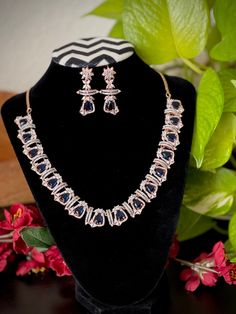 -Fall in love with this simple rose gold two tone finished CZ AD necklace and earrings jewelry set! -Will suit very well for ethnic dresses for parties, weddings, and gatherings! Earrings measurements: -------------------------- Height: 4 cm Width : 1.8 cm  Care Instruction : Avoid Heat & Chemicals Like Perfume, Deo, Alchol, Etc. | Clean With Dry Cotton Cloth | Pack In An Air Tight Container After Use Rose Gold Plated Jewelry For Party, Elegant Party Bridal Necklace, Plated, Elegant Plated Bridal Necklace For Party, Elegant Bridal Necklace For Party, Elegant Blue Jewelry Sets For Festive Season, Elegant Blue Jewelry Sets For Festive Occasions, Festive Rose Gold Jewelry For Celebration, Festive Celebration Rose Gold Jewelry, Formal Rose Gold Jewelry Sets With Elegant Design