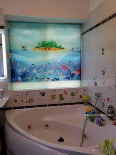 a bathroom with a large bathtub next to a sink under a painting on the wall