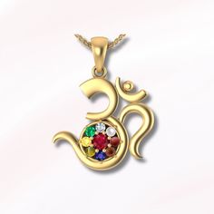 About Item -  Item :-  Om navratana pendant , Navratan necklace  Material :- Pure silver Stone :- Emerald , Zircon , Ruby , Hessonite garnet , Blue Sapphire , Yellow Sapphire , Pearl , Coral , Cat's eye. Stone size - 4 mm Centre                       2.5 mm other      Purity :- 92.5 pure silver  Dimensions :- Length (32.85) mm                          Width   (24.90) mm   Item Title :- Om pendant, Navratan Om Pendant, Aum Chain Pendant, precious stones, Spiritual Gifts, Om Necklace, religious pendent, auspicious jewelry. Description:- We use pure 925 silver for our jewelry. All stones that we display are 100% natural. We accept all types of custom & personalized order. Please send us a message if you are interested in a custom creation.  Shipping profile :- We will ship all our orders with Spiritual Gemstone Necklaces For Celebration, Temple Necklace With Gemstone Pendant For Celebration, Gemstone Temple Necklace Pendant For Celebration, Temple Pendant Necklace With Gemstone For Celebration, Multicolor Gemstone Temple Necklace Gift, Spiritual Gemstone Jewelry For Diwali, Spiritual Temple Necklace With Gemstones For Festive Occasions, Spiritual Round Pendant Necklace For Diwali, Yellow Gold Gemstone Necklaces For Festivals