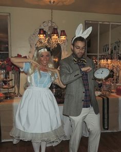 a man and woman dressed up in costumes