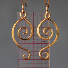 The unique Rococo scroll earrings are handmade using copper wire. It is inspired by Rococo style. Rococo style is elegant, ornate and use a lot of curves. It is playful and witty. Despite it popularity among the world, the Rococo is quintessentially the French Style. The Length of the earrings is 1 1/2 inches, 37mm. ;-) My contact number: 909-822-8348. Please contact me if you would like to order multiples or customize a design for your special event, I will be pleased to give you a discount on Earrings Bridesmaid, Rococo Style, Bridesmaid Earrings, Bridesmaid Gift, Gift Birthday, Candle Sconces, Copper Wire, Gift For Mom, Bridesmaid Gifts