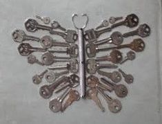 a bunch of keys are arranged in the shape of a butterfly