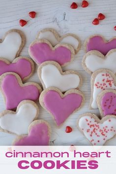 some heart shaped cookies are on a table