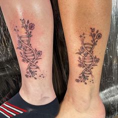 two people with matching tattoos on their legs