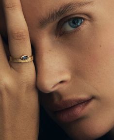 The Alessandra Ring, with its evocative evil eye design, features a marquise-cut iolite accented with a pair of dark blue sapphires.

#sapphirering #goldring #evileyering #evileyejewellery #sapphirejewellery #chunkyring #sculpturaljewellery Sapphire Ring Gold, Evil Eye Design, Gold Sapphire Ring, Evil Eye Ring, Diamond Guide, Chunky Rings, Eye Design, Engagement Ring Wedding Band, Marquise Cut