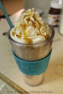 a cup filled with ice cream sitting on top of a counter