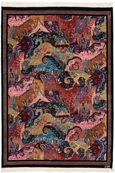 an intricately designed, multicolored rug with many different colors and designs on it