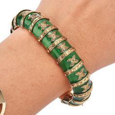 Be amazed by this vintage 1930's green Enamel 18K Yellow Gold flexible snake Bracelet. The green Paillonne enamel shine with every movement. Elegant Hand-carved engraving of the gold detailing enhances this bracelet's eye-catching effect. For security, this 79.2-gram bracelet has two two safety clasp for securing. Measurements: 17 mm width X 7.0 Inches Weight: 98.2 Grams Clasp: Insert Clasp Condition: Excellent Accompanied by an official appraisal document. Green Enamel Bangle, Snake Green, Two Two, 18k Gold Bracelet, Yellow Gold Wedding Band, Jewelry Appraisal, Snake Bracelet, Luxury Timepieces, Green Enamel