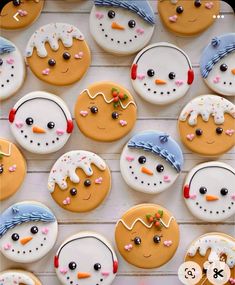 many decorated cookies are arranged in the shape of snowmen