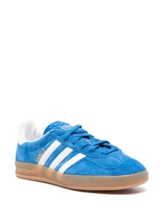 Find ADIDAS Gazelle Suede Sneakers on Editorialist. electric blue calf suede two-tone design logo print to the side logo-debossed tongue signature 3-Stripes logo contrasting branded heel counter round toe branded insole flat rubber sole front lace-up fastening Adidas Blue Sneakers With Three Stripes, Blue Low-top Sneakers With Three Stripes Branding, Suede Sneakers With Three Stripes Branding For Sports, Blue Suede Sporty Sneakers, Blue Sports Sneakers With Logo, Blue Sneakers With Three Stripes Branding, Blue Suede Sneakers For Sports, Blue Leather Adidas Sneakers, Blue Sporty Sneakers With Logo