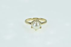 14K 7.5mm Vintage Pearl Classic Statement Ring Size 5.5 Yellow Gold *Weight: 3.5g *Center Gem Stone: 7.5mm Cultured Pearl *Composition: 14k Gold Marked *Condition: Estate:Good *Ring Size: 5.5 *Era: Vintage Estimated Retail Replacement Value: $749.99 Please note: Unless otherwise noted, our items are solid gold (i.e. if it is listed as 14K Gold, it means it is solid 14K, not gold plated). Where applicable, all diamonds are graded according to GIA grading standards, the diamonds are NOT enhanced, unless noted. All gemstone weights are approximations based on measurements using industry accepted standards. *The ruler used measures in both centimeters and inches, with centimeters being closest to the item or closest to the top of the image.   *EM98594* [CTXQ] Vintage Pearl, Rings Cool, Vintage Pearls, Gem Stone, Cultured Pearls, Statement Ring, Ruler