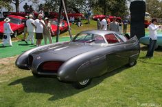 an antique car on display at a car show