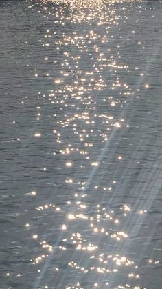 the sun shines brightly on the water as it reflects off the surface of the water