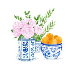 two blue and white vases with flowers in them