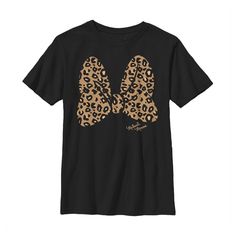 a black t - shirt with an animal print on the chest and two large, brown spots