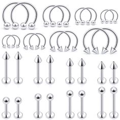 an assortment of surgical piercings in various shapes and sizes