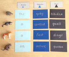 several different types of animals are shown on the table with matching cards and magnets