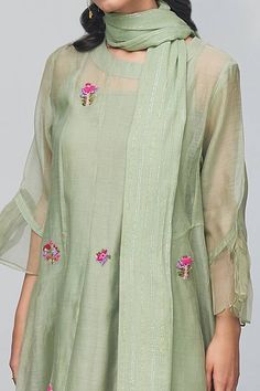 Olive green kurta with all-over floral embroidery, lace detailing, round neckline and pleats at the cuffs. Comes with pant, stole and inner slip.
Component: 4
Embroidered
Neckline: Round
Sleeve Length: Three Quarter
Fabric: Kurta: Chanderi Pant and Inner Slip: Cotton
Color: Green
Straight kurta
Keyhole at the back
Sheer hem panel pant - Aza Fashions Green Dupatta For Spring Festivals, Green Festive Dupatta For Spring, Summer Straight Kurta Set With Embroidered Sleeves, Summer Straight Kurta With Embroidered Sleeves, Summer Embroidered Sleeves Straight Kurta Set, Summer Cotton Silk Sets With Floral Embroidery, Summer Sets With Embroidered Sleeves And Straight Kurta, Green Sets With Dupatta For Summer, Green Sets With Dupatta For Spring