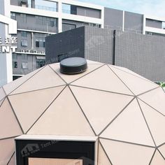 a large dome structure with a door in the center