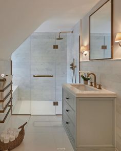 an instagram photo of a bathroom with marble counter tops and white tile flooring