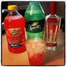 two bottles of sprite, strawberry lemonade and a glass with ice