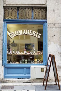 a store front with a sign in front of it that says bromagerie