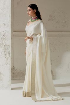 Ivory silk satin saree with woven gota edging. Paired with a hand embroidered blouse. - Aza Fashions Silk Pre-draped Saree With Embroidered Border For Puja, Wedding Raw Silk Pre-draped Saree With Border, Elegant Pre-draped Saree With Embroidered Border For Wedding, Wedding Pre-draped Saree With Embroidered Border In Slub Silk, Formal Saree With Embroidered Border, Elegant Traditional Wear With Border For Eid, White Silk Pre-draped Saree In Traditional Style, Off White Silk Saree For Wedding, White Silk Saree With Traditional Drape