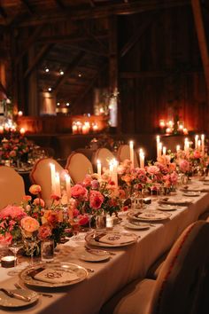 a long table is set with candles and flowers for an elegant dinner or banquet event