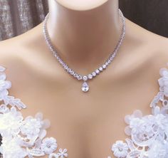 "AAA quality clear white cubic zirconia 7mm - 3mm gradation round stones with tarnish resistant high-quality rhodium plated metal setting tennis necklace. Elegant and super flawless sparkling with a teardrop pendant. The necklace measures 15, 15 1/2 or 16\" . Matching bracelet https://www.etsy.com/listing/85607281/bridal-wedding-bracelet-party-pageant?ref=related-7 Matching earrings https://www.etsy.com/listing/116098279/bridal-earrings-wedding-earrings-bridal?ref=shop_home_active&ga_search_ Collar Necklace Choker, Bridal Pearl Necklace, Necklace Elegant, Diamond Jewelry Designs, Party Necklace, Tennis Necklace, Matching Bracelet, Teardrop Pendant, Wedding Jewellery Necklace