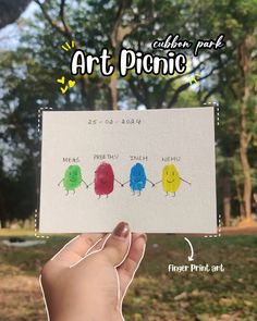 someone is holding up a card with three little birds on it and the words art pono written in different colors