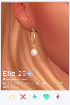 an image of a woman's ear with earrings on it