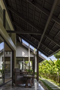 an outdoor living area with patio furniture and plants